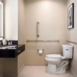 Private guest bathroom with shower at The Shelburne Sonesta New York.