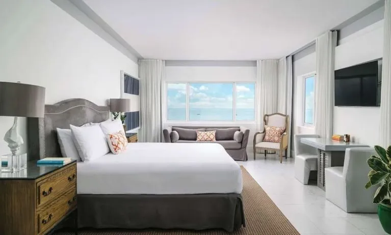 Bright and spacious day use room with workspace and lounge seating at Nautilus Sonesta Miami Beach.