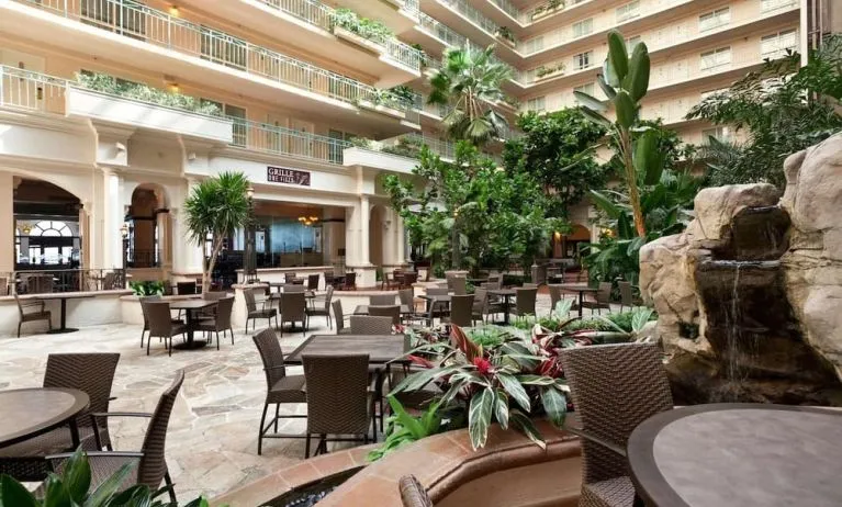 Breakfast area with natural light perfect for coworking at Embassy Suites By Hilton San Francisco Airport Waterfront.