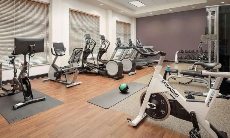 Well-equipped fitness center at Embassy Suites By Hilton Birmingham.