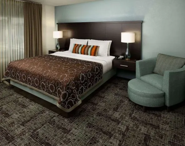 King bed at Sonesta ES Suites Atlanta Alpharetta Avalon.