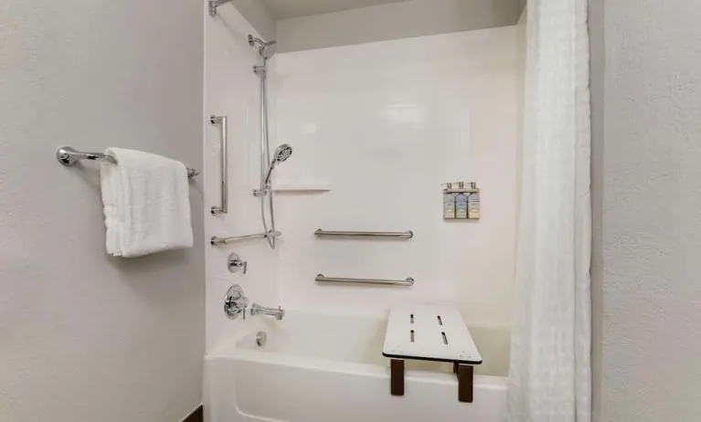 Accessible private bathroom with shower at Sonesta Simply Suites Miami Airport Doral.