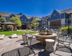 Patio with lounge seating and fire pit at Sonesta ES Suites Denver South - Park Meadows.
