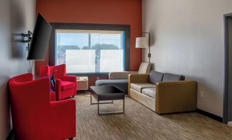 Suite with living room at Holiday Inn Express & Suites Yorkville.