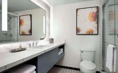 Private guest bathroom with shower and free toiletries at Sonesta Los Angeles Airport LAX.