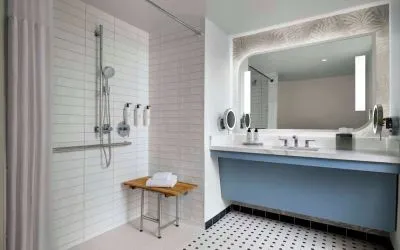 Accessible guest bathroom with shower at Sonesta Los Angeles Airport LAX.