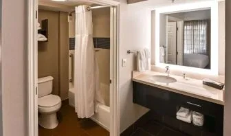 Private guest bathroom with combined shower and tub at Sonesta ES Suites San Antonio Northwest - Medical Center.