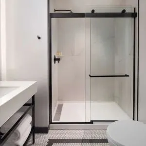 Private guest bathroom with shower at The Clift Royal Sonesta.