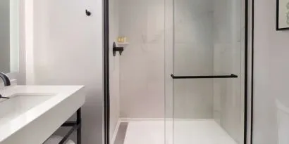 Private guest bathroom with shower at The Clift Royal Sonesta.