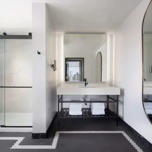 Private guest bathroom with shower at The Clift Royal Sonesta.
