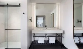 Private guest bathroom with shower at The Clift Royal Sonesta.