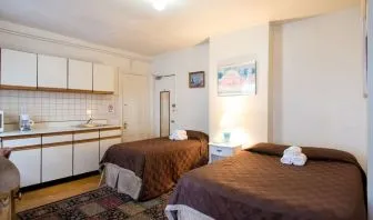 Day use twin room with in-room kitchen and work desk at The Farrington Inn.