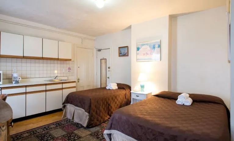 Day use twin room with in-room kitchen and work desk at The Farrington Inn.