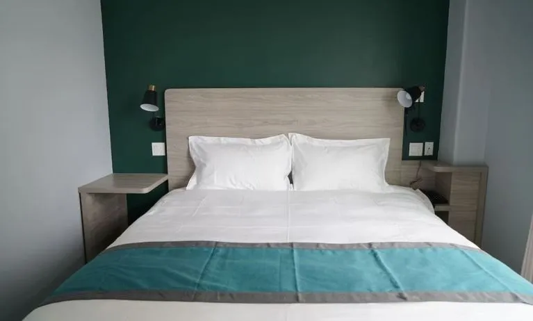 King bed at Starlight Hotel.