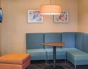 Lobby workspace with comfortable seating at Sonesta ES Suites Charlottesville University.