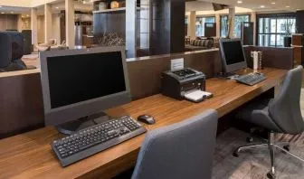 Business center with computers, printer and ergonomic chairs at Sonesta Select Seattle Bellevue Redmond.