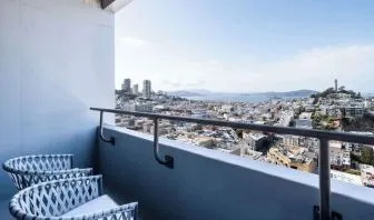 Balcony inside day use room overlooking the city at Hilton San Francisco Financial District.
