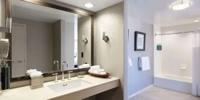 Guest bathroom with shower and tub at Hilton San Francisco Financial District.