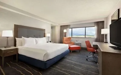 Comfortable king room with work desk and lounger at DoubleTree By Hilton Albuquerque.
