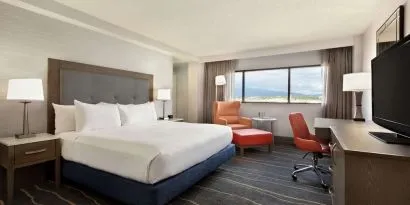 Comfortable king room with work desk and lounger at DoubleTree By Hilton Albuquerque.