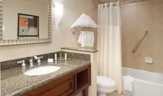 Guest bathroom with shower and tub at DoubleTree By Hilton Albuquerque.