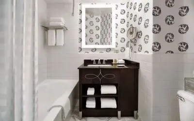 Guest bathroom with shower and tub at Palmer House A Hilton Hotel.