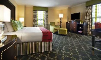 Spacious king suite with work desk and lounger at Palmer House A Hilton Hotel.