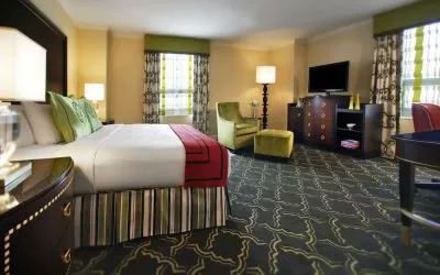 Spacious king suite with work desk and lounger at Palmer House A Hilton Hotel.
