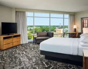 Spacious day use room with work desk overlooking the city at Embassy Suites By Hilton Hampton Convention Center.