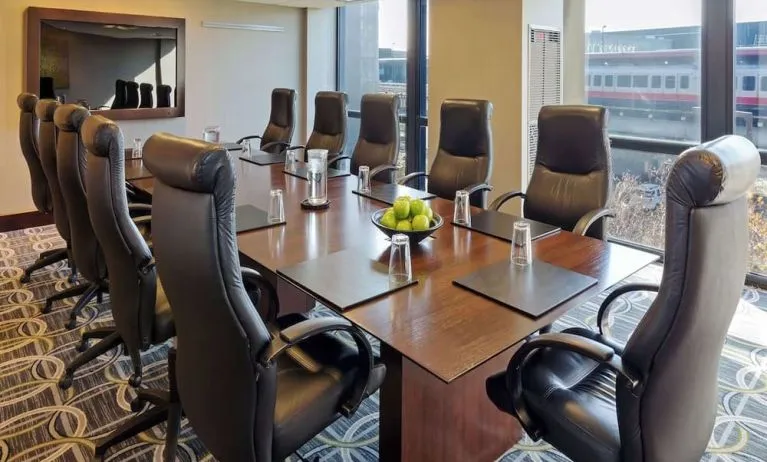 Bright-lit meeting room at Hilton Chicago O'Hare Airport.