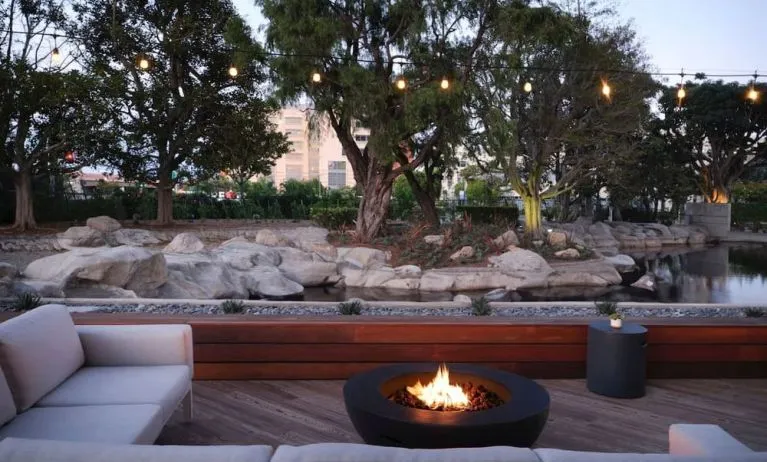 Firepit surrounded by comfortable chairs at Hotel Fera Anaheim, A DoubleTree By Hilton.