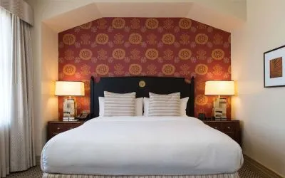 King bed at The Stephen F Austin Royal Sonesta Hotel.