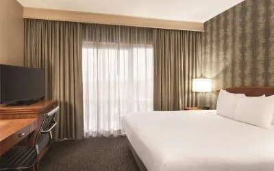 Day use room with work desk and natural light at Embassy Suites By Hilton Nashville South Cool Springs.
