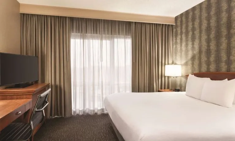 Day use room with work desk and natural light at Embassy Suites By Hilton Nashville South Cool Springs.