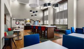 Lobby and coworking lounge at Hampton Inn & Suites Schererville.