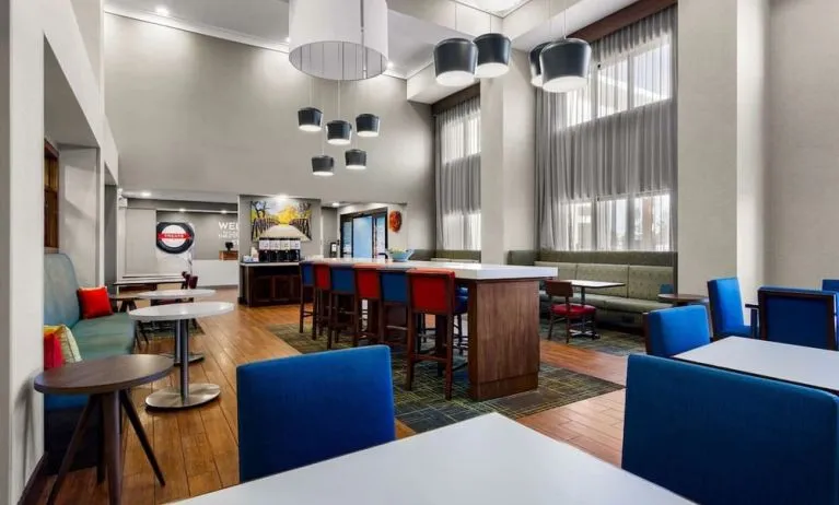 Lobby and coworking lounge at Hampton Inn & Suites Schererville.
