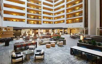 Spacious lobby and coworking lounge at Hilton Charlotte Airport.
