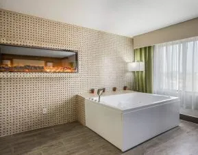 Bath tub inside day use room at The Leo Collection, An Ascend Collection Hotel.