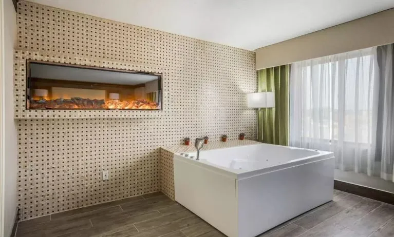 Bath tub inside day use room at The Leo Collection, An Ascend Collection Hotel.