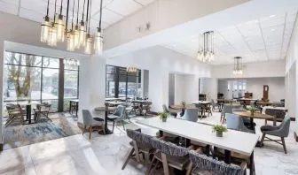Dining area perfect for coworking at Doubletree By Hilton Houston Medical Center Hotel & Suites.