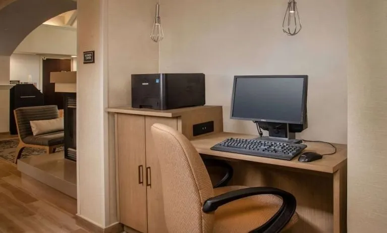 Business center with computer, printer and ergonomic chair at Sonesta ES Suites Baltimore BWI Airport.
