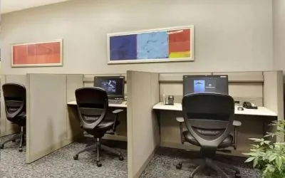 Business center with computers, printer and ergonomic chairs at New York Hilton Midtown.