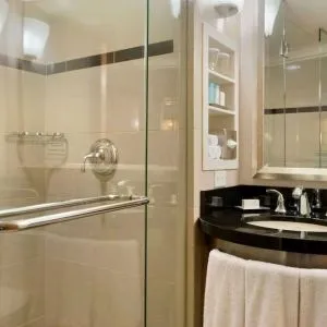 Guest bathroom with shower at New York Hilton Midtown.