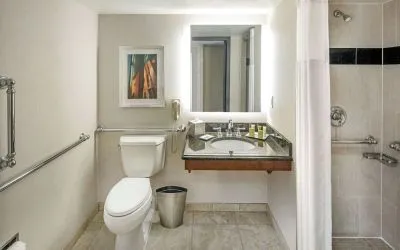 Private guest bathroom with shower and free toiletries at Hilton Minneapolis.