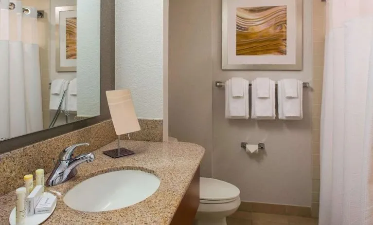 Private guest bathroom with shower and free toiletries at Sonesta Select Boston Lowell Chelmsford.