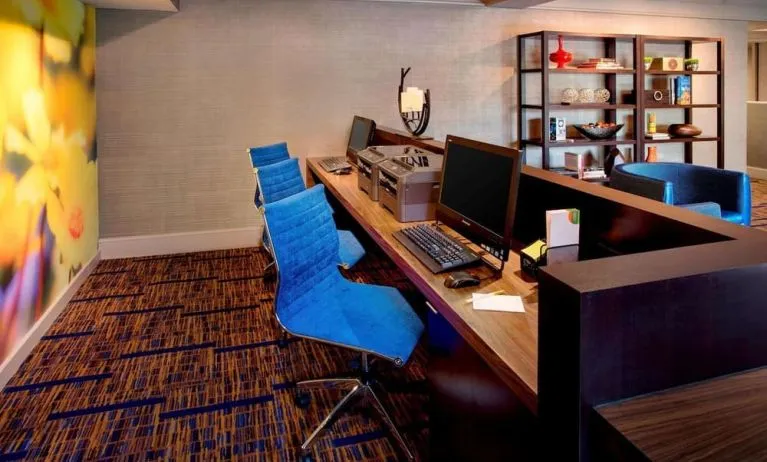 Business center with computers, printer and ergonomic chairs at Sonesta Select Boston Danvers.