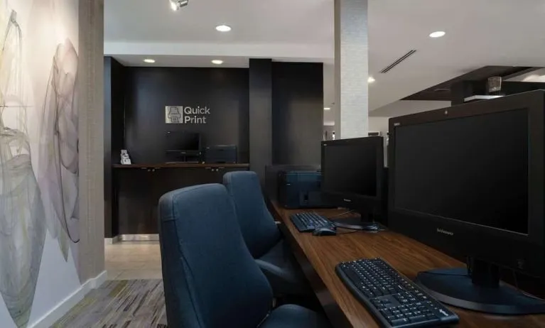Business center with computers, printer and ergonomic chairs at Sonesta Select Chattanooga Hamilton Place.