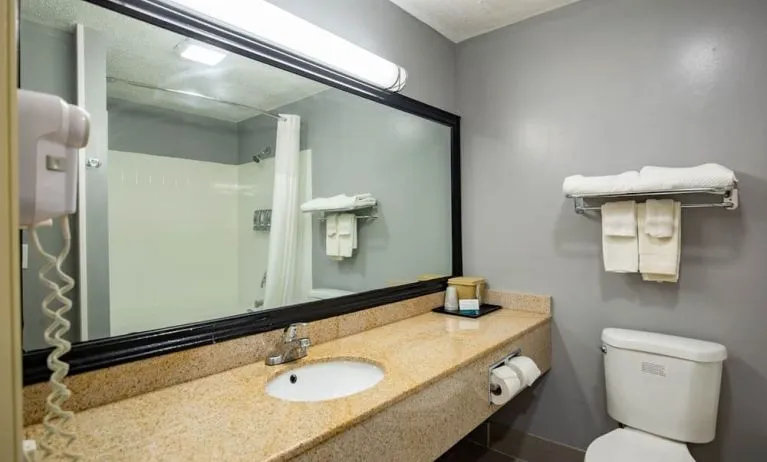 Guest bathroom at Quality Inn & Suites Woodstock Near Lake Geneva.