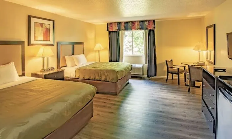 Queen beds at Quality Inn & Suites Woodstock Near Lake Geneva.