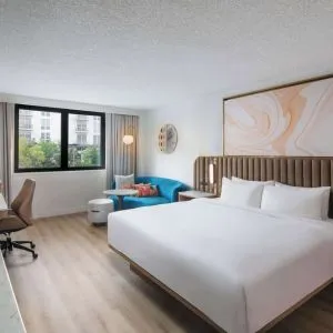 Bright and spacious day use room with work des at Sonesta Miami Airport.